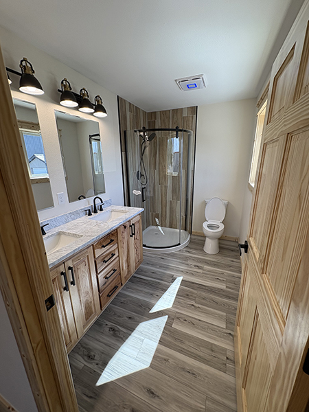 Blackduck house bathroom with corner shower